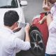 Two drivers man arguing after a car traffic accident collision and making phone call to Insurance Agent and take a photo, Traffic Accident and insurance concept.